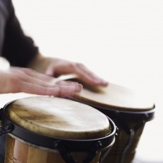 Man playing the bongo drums close-up of hands